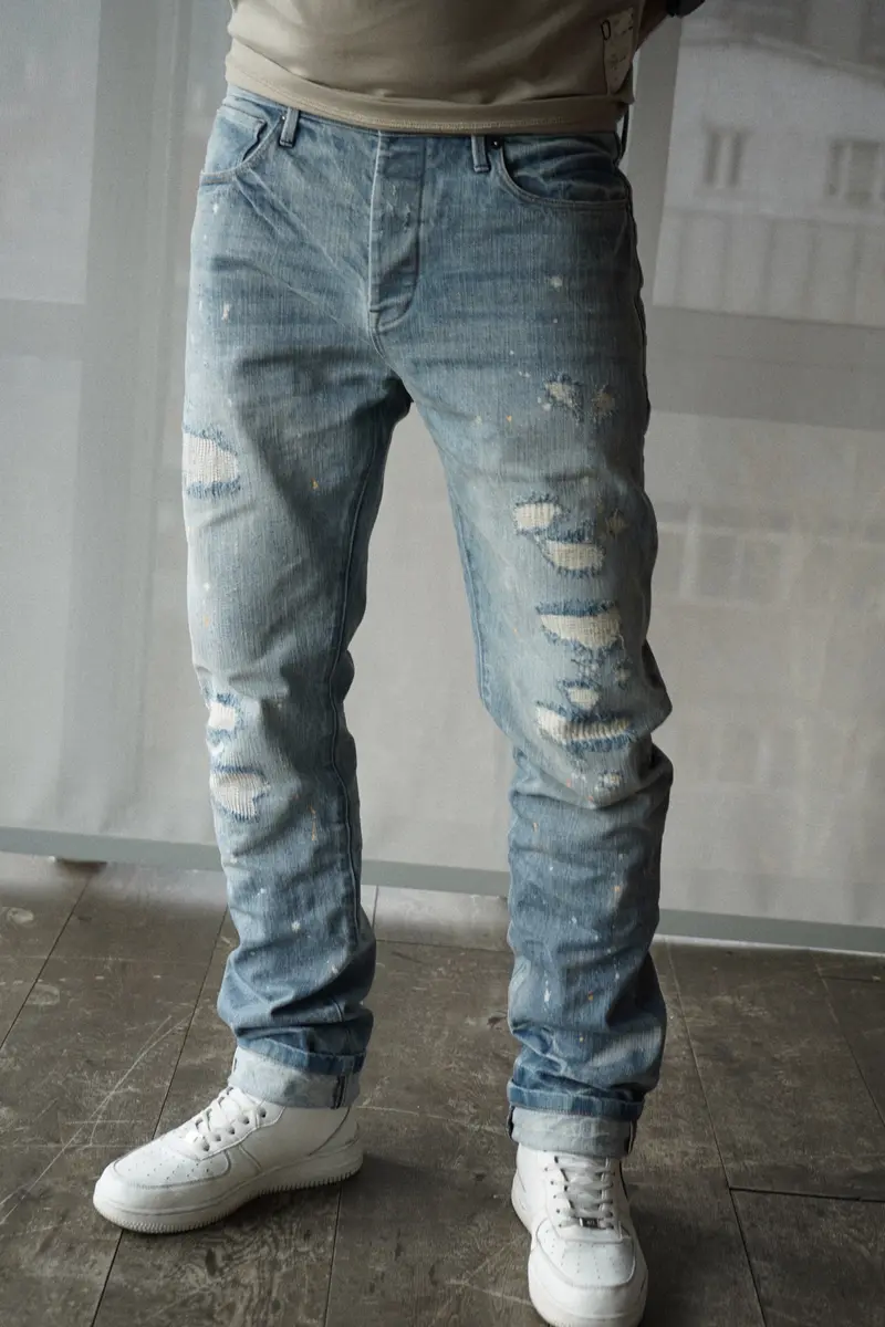 slim fit denim jeans with selvedge. light destroyed wash