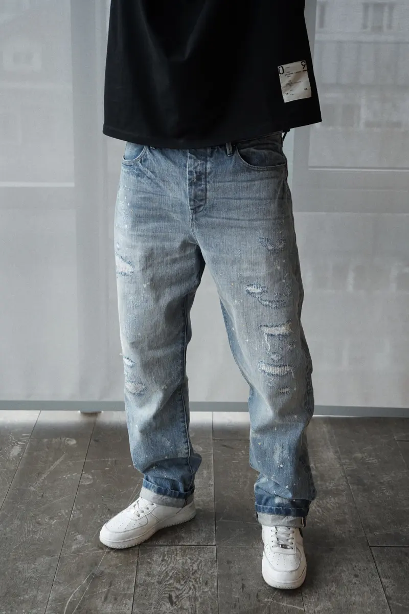 relaxed fit denim jeans with selvedge. light destroyed wash